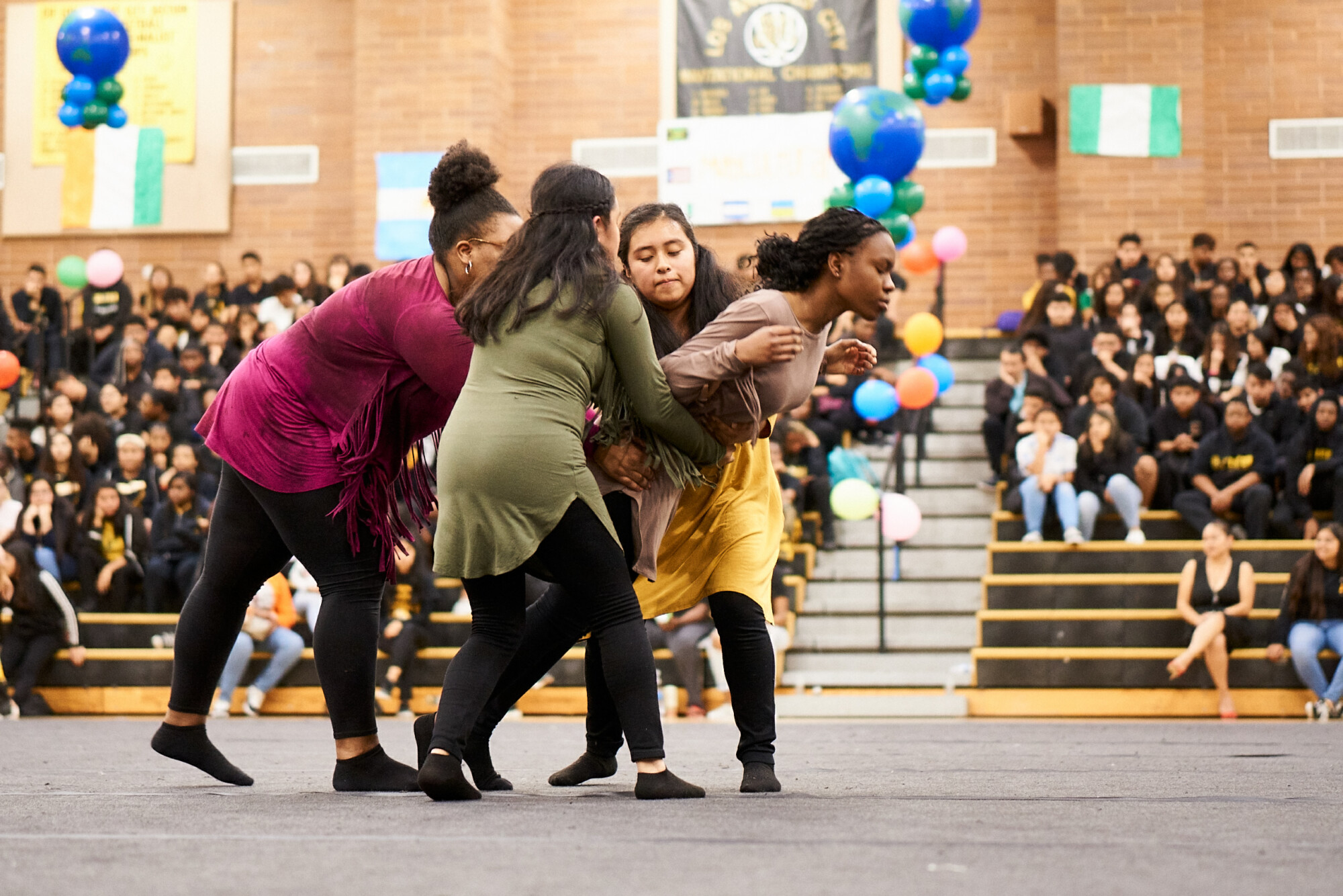 Dance students performing at a school assembly
