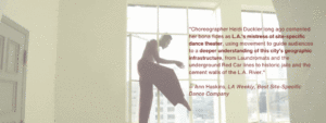 Man dancing in front of a window