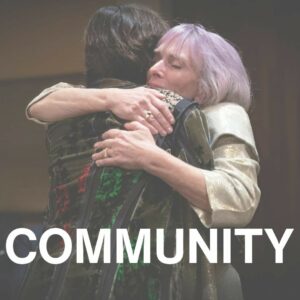 Heidi Duckler hugs an HDD supporter; text reads "Community"