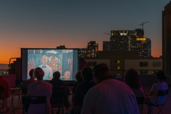 Audience watches a short Heidi Duckler Dance film on the rooftop.
